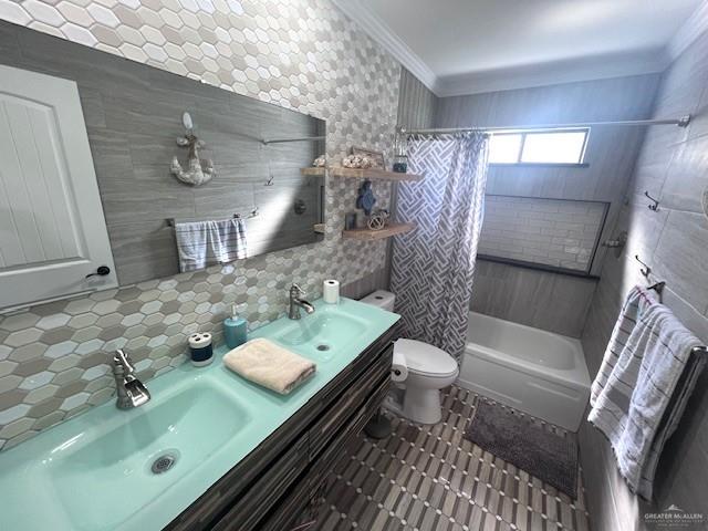 full bathroom featuring shower / tub combo, vanity, tile walls, and ornamental molding