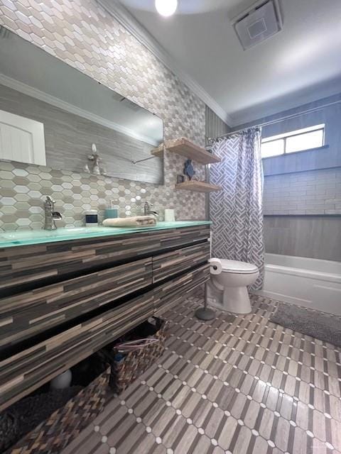 full bathroom featuring crown molding, toilet, decorative backsplash, vanity, and shower / tub combo