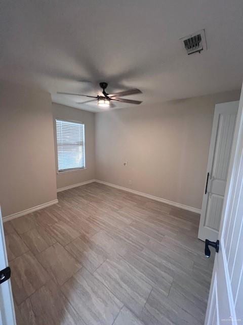 spare room with ceiling fan