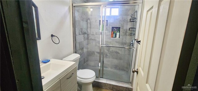 117 N Jo Beth St, Alton, TX 78573 - bathroom featuring toilet, vanity, and a stall shower