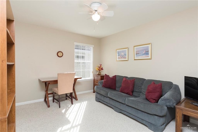 carpeted living room with ceiling fan