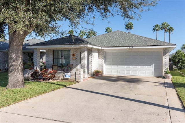 ranch-style house featuring a front yard and a garage