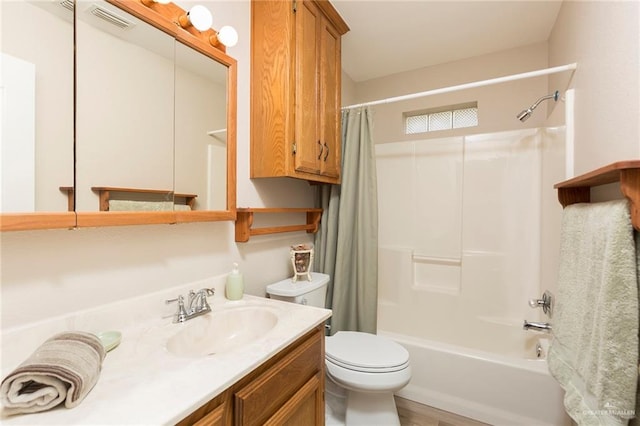 full bathroom featuring wood-type flooring, vanity, toilet, and shower / tub combo with curtain