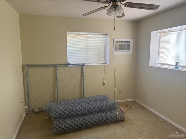 4800 E Mile 6th Rd, Mcallen, TX 78504 - bedroom with an AC wall unit, baseboards, and light floors