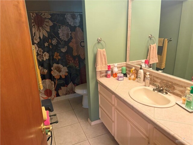 4800 E Mile 6th Rd, Mcallen, TX 78504 - full bathroom featuring vanity, tile patterned floors, toilet, and a shower with curtain