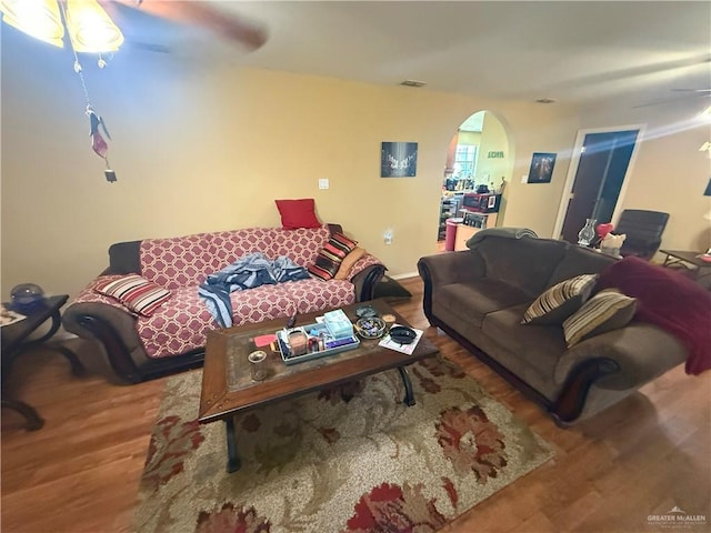 4800 E Mile 6th Rd, Mcallen, TX 78504 - living area with arched walkways, wood finished floors, and ceiling fan
