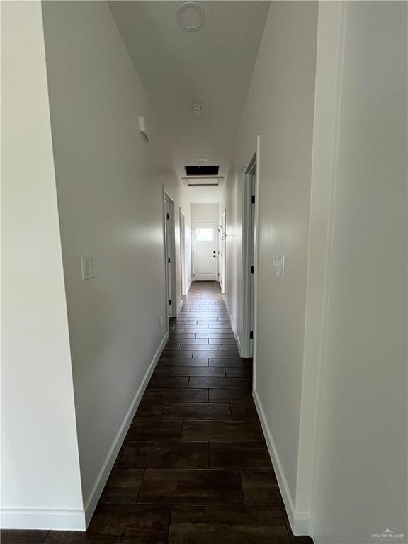 808 E Evans Ave, Pharr, TX 78577 - hallway featuring dark wood-style flooring and baseboards