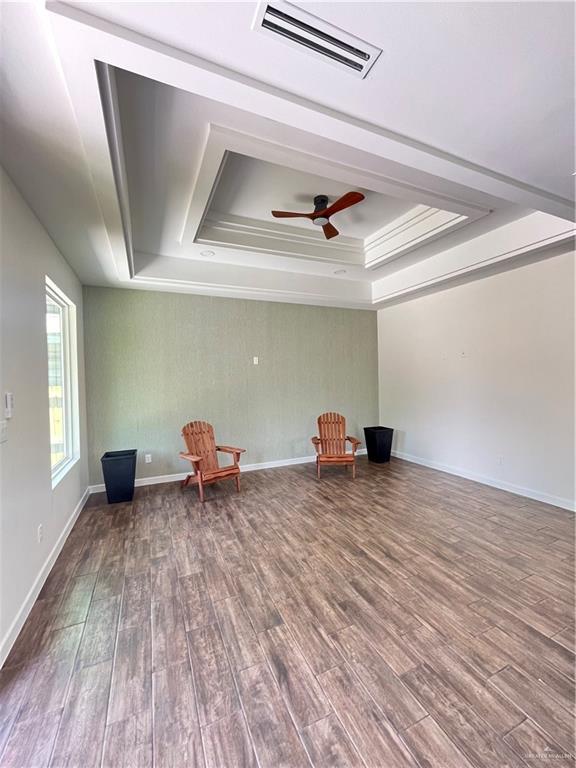 808 E Evans Ave, Pharr, TX 78577 - living area with a raised ceiling, wood finished floors, and a ceiling fan