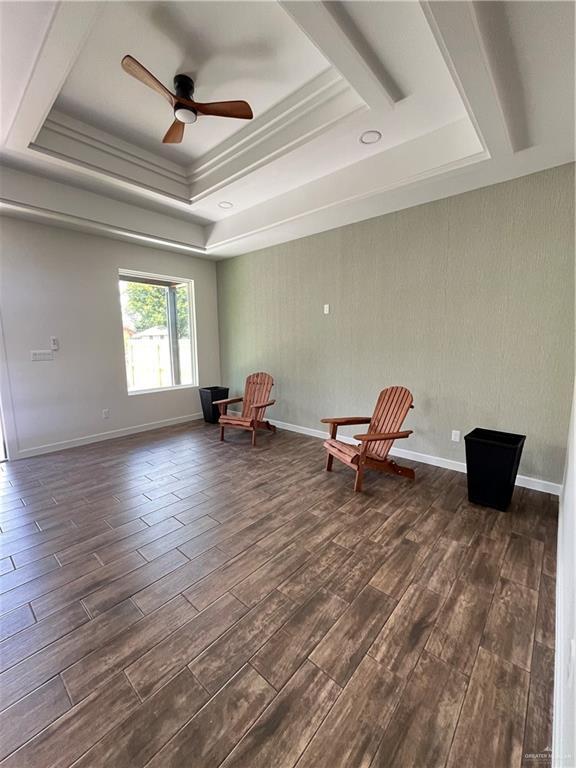 808 E Evans Ave, Pharr, TX 78577 - sitting room featuring a tray ceiling, dark wood-style flooring, and ceiling fan