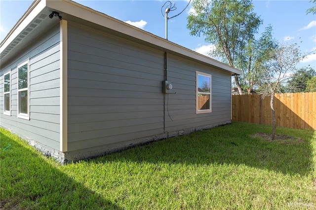 view of home's exterior with a yard