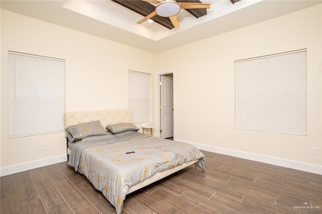 bedroom featuring ceiling fan and dark wood-type flooring