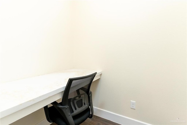 home office with dark wood-type flooring