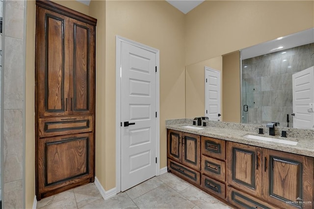 bathroom featuring vanity and a shower with shower door