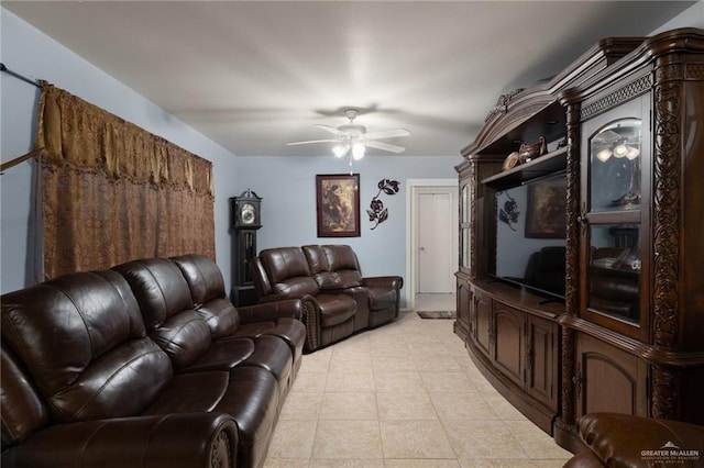 living room featuring ceiling fan and light tile patterned floors