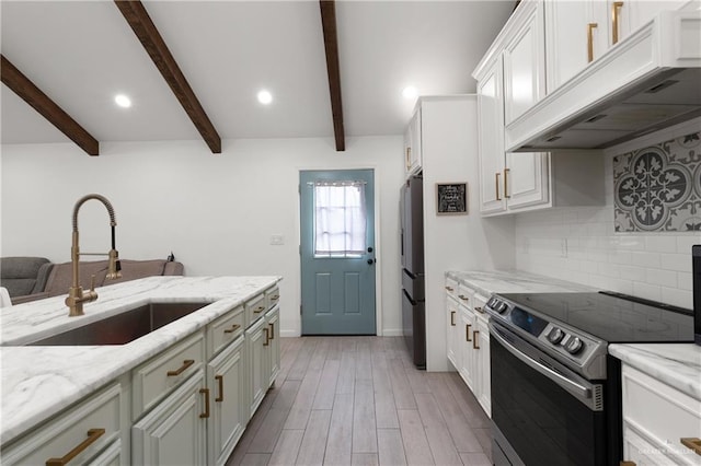 kitchen featuring under cabinet range hood, a sink, electric stove, backsplash, and beamed ceiling