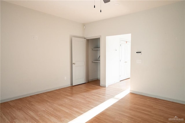 unfurnished bedroom featuring ceiling fan and light hardwood / wood-style floors