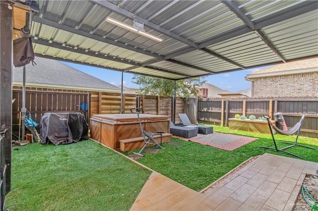 view of yard featuring a patio area and a hot tub