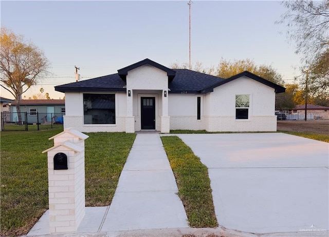 view of front of house with a lawn