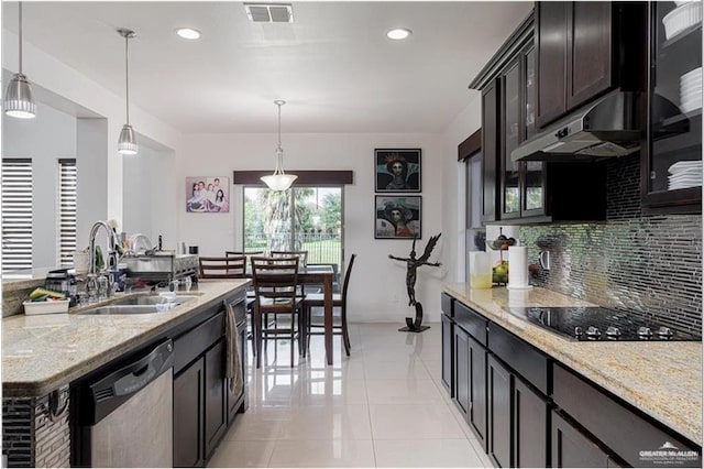 kitchen featuring stainless steel dishwasher, backsplash, pendant lighting, and sink