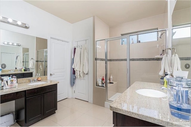 bathroom with vanity, tile patterned floors, and an enclosed shower