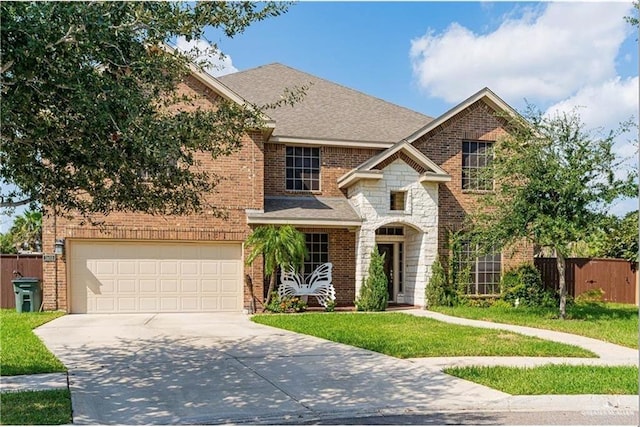 view of front of house featuring a front yard and a garage