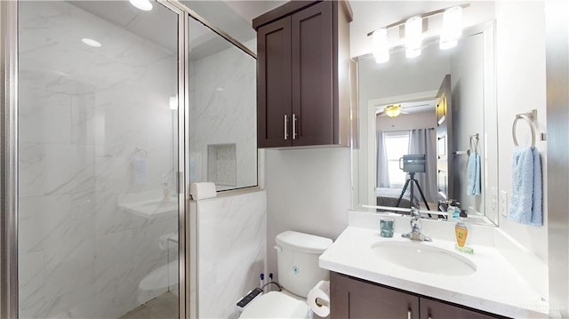 1208 E Camellia Ave Unit 2, Mcallen, TX 78501 - full bathroom with a ceiling fan, toilet, vanity, and a marble finish shower