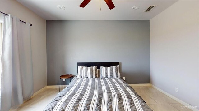 1208 E Camellia Ave Unit 2, Mcallen, TX 78501 - bedroom featuring light tile patterned flooring, visible vents, a ceiling fan, and baseboards