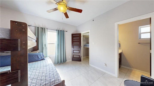 1208 E Camellia Ave Unit 2, Mcallen, TX 78501 - bedroom with a spacious closet, baseboards, and light tile patterned floors