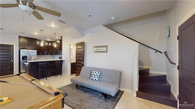 1208 E Camellia Ave Unit 2, Mcallen, TX 78501 - living room with baseboards, visible vents, stairs, ceiling fan, and light tile patterned floors