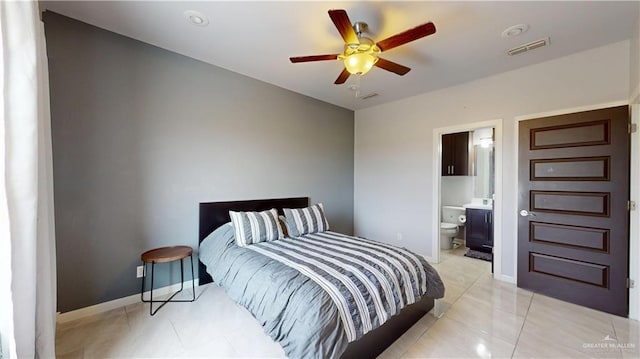 1208 E Camellia Ave Unit 2, Mcallen, TX 78501 - bedroom featuring light tile patterned flooring, ensuite bathroom, baseboards, visible vents, and ceiling fan