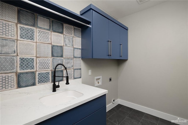 3404 Saint Honore Dr, Mcallen, TX 78504 - laundry area featuring cabinet space, hookup for an electric dryer, washer hookup, and dark tile patterned floors