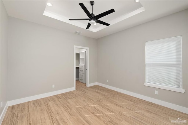 3404 Saint Honore Dr, Mcallen, TX 78504 - unfurnished room featuring a tray ceiling, a ceiling fan, light wood-style flooring, and recessed lighting