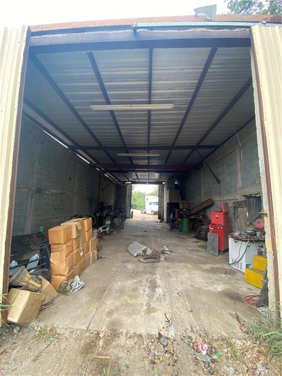 garage featuring a carport