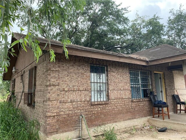 11732 Rogers Rd, Edinburg, TX 78542 - view of side of home with brick siding