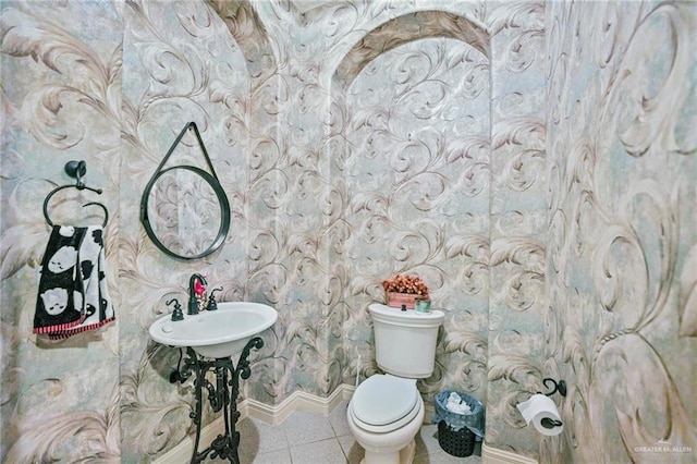 bathroom with tile patterned floors and toilet