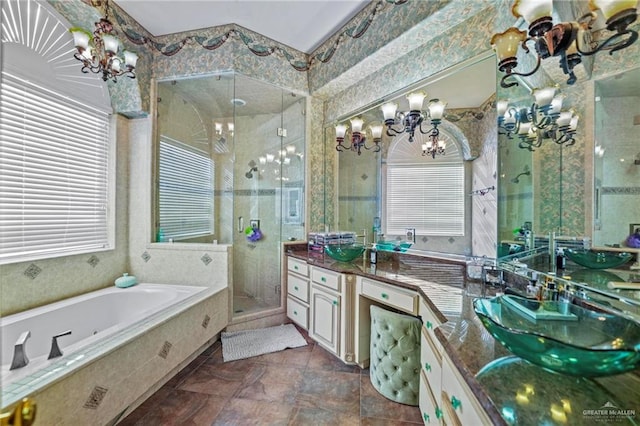 bathroom featuring vanity, a healthy amount of sunlight, and shower with separate bathtub