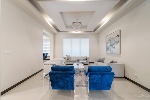 living room with light tile patterned floors, a tray ceiling, and a chandelier