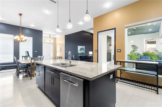 kitchen featuring pendant lighting, sink, a kitchen island with sink, stainless steel dishwasher, and light tile patterned floors