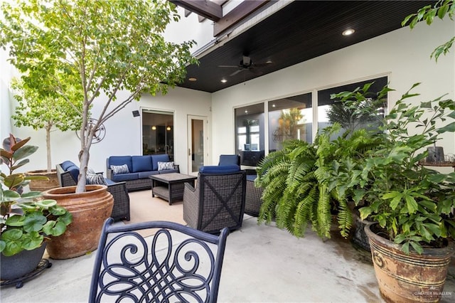 view of patio featuring an outdoor living space and ceiling fan