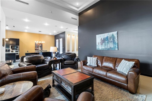 living room with an inviting chandelier