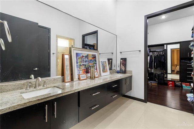 bathroom with vanity and tile patterned flooring