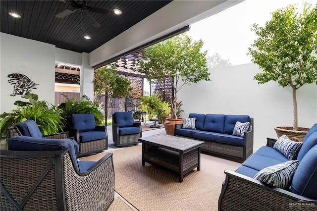 view of patio featuring an outdoor hangout area and ceiling fan