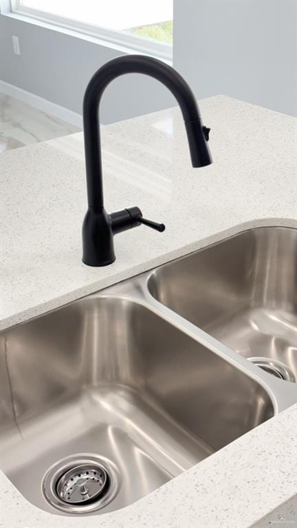 interior details with sink and light stone counters