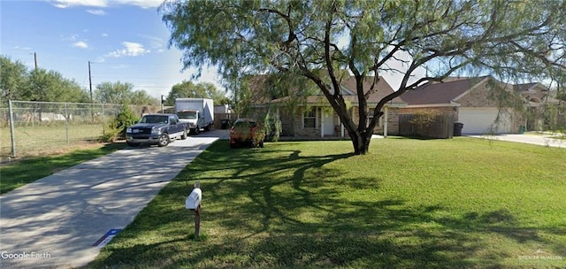 view of front of home featuring a garage and a front lawn