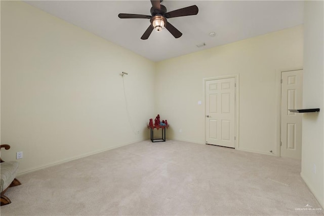 empty room with light carpet and ceiling fan