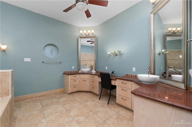 bathroom featuring tile patterned floors, ceiling fan, and vanity