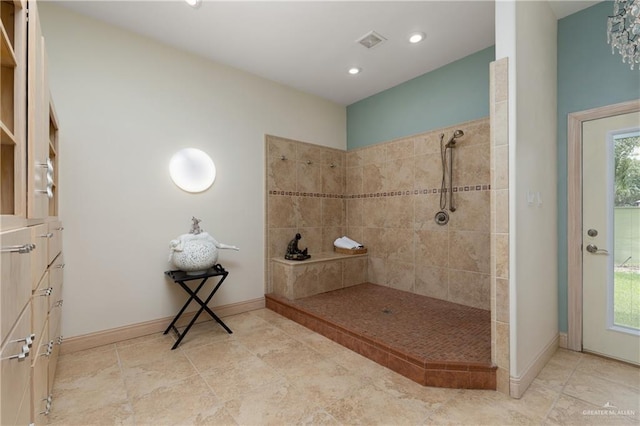 bathroom with tiled shower