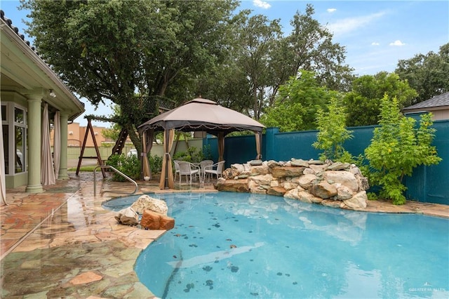 view of swimming pool with a gazebo