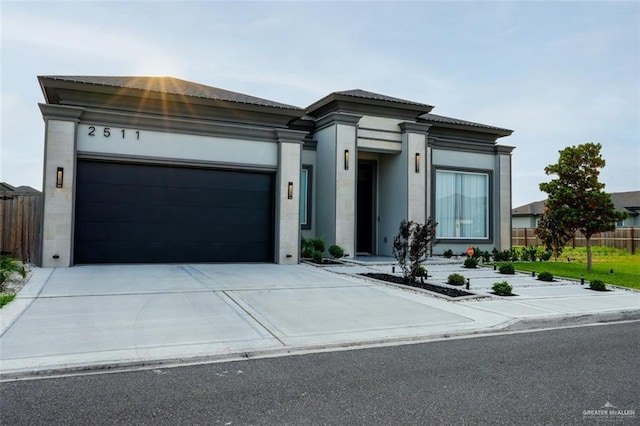 2511 Wisteria St, Mission, TX 78574 - prairie-style home featuring driveway, an attached garage, and stucco siding