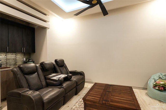 2511 Wisteria St, Mission, TX 78574 - cinema with ceiling fan, light wood finished floors, and a skylight